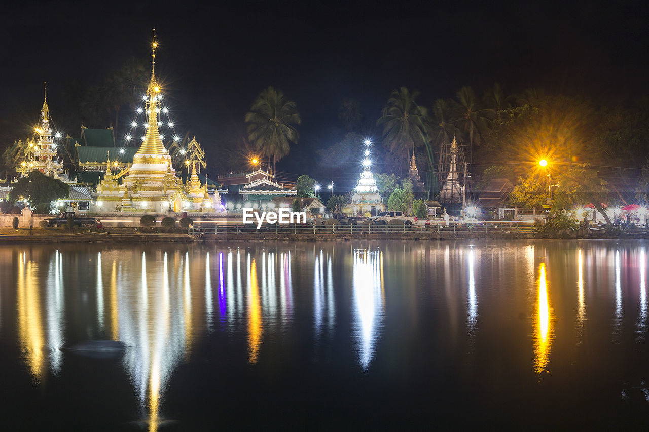 REFLECTION OF ILLUMINATED BUILDINGS IN WATER