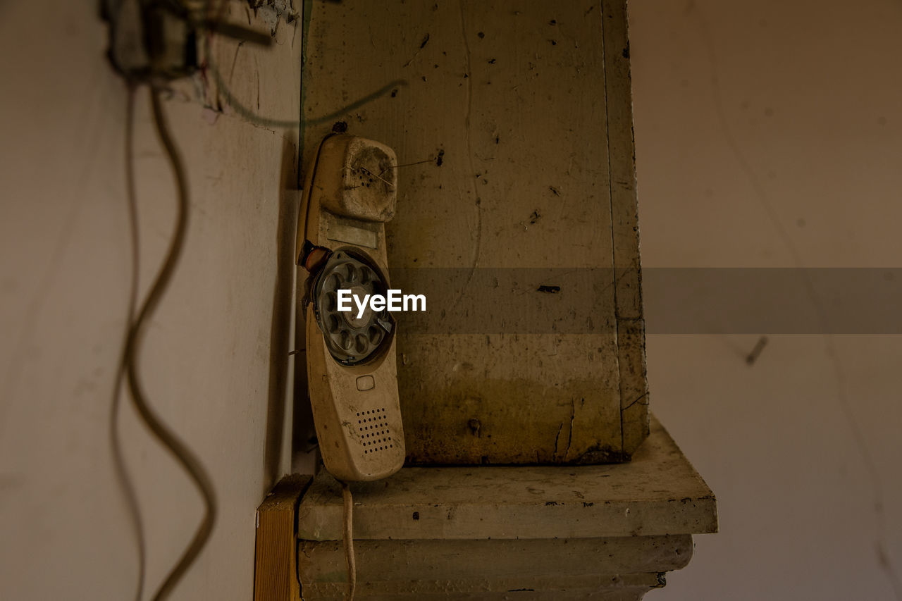 Close-up of abandoned telephone