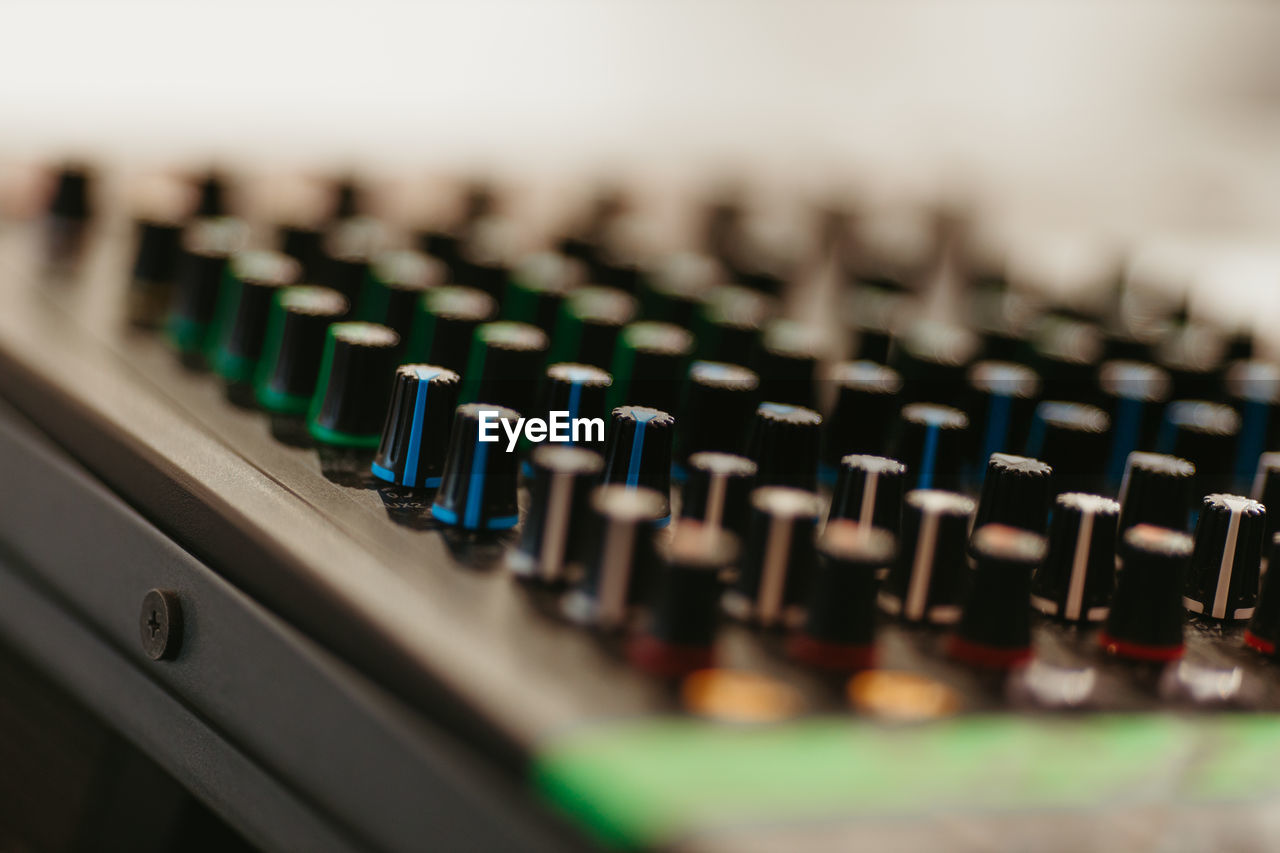 CLOSE-UP OF SOUND MIXER AT AIRPORT