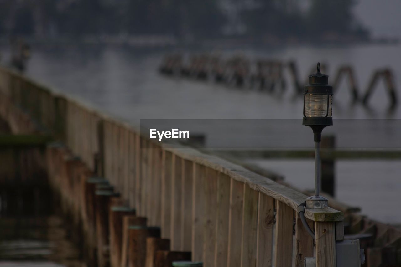 Close-up of railing against sea