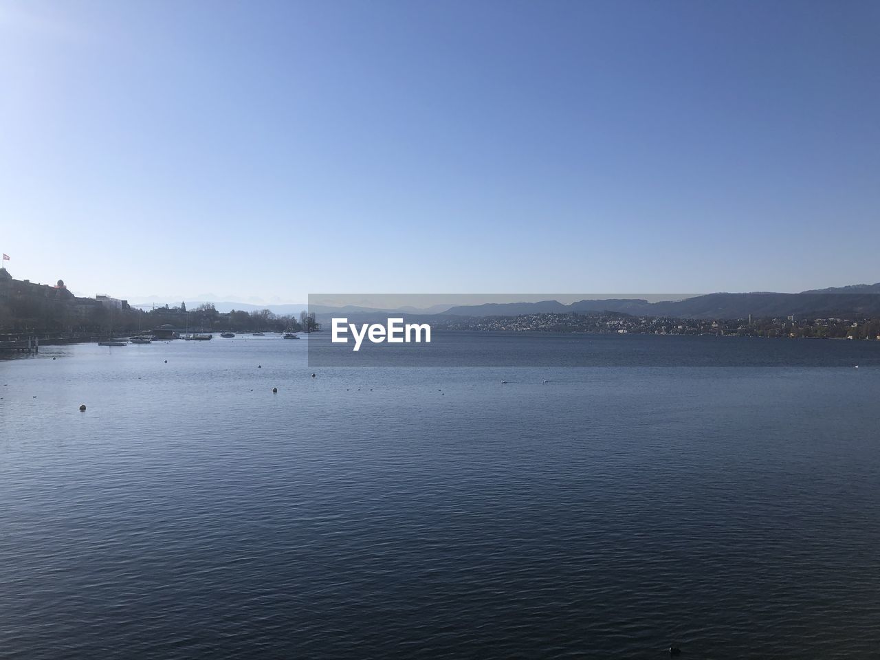 PANORAMIC VIEW OF LAKE AGAINST CLEAR SKY