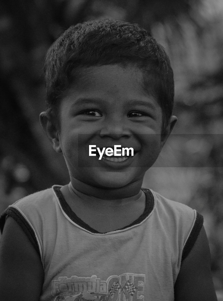 close-up portrait of boy looking away