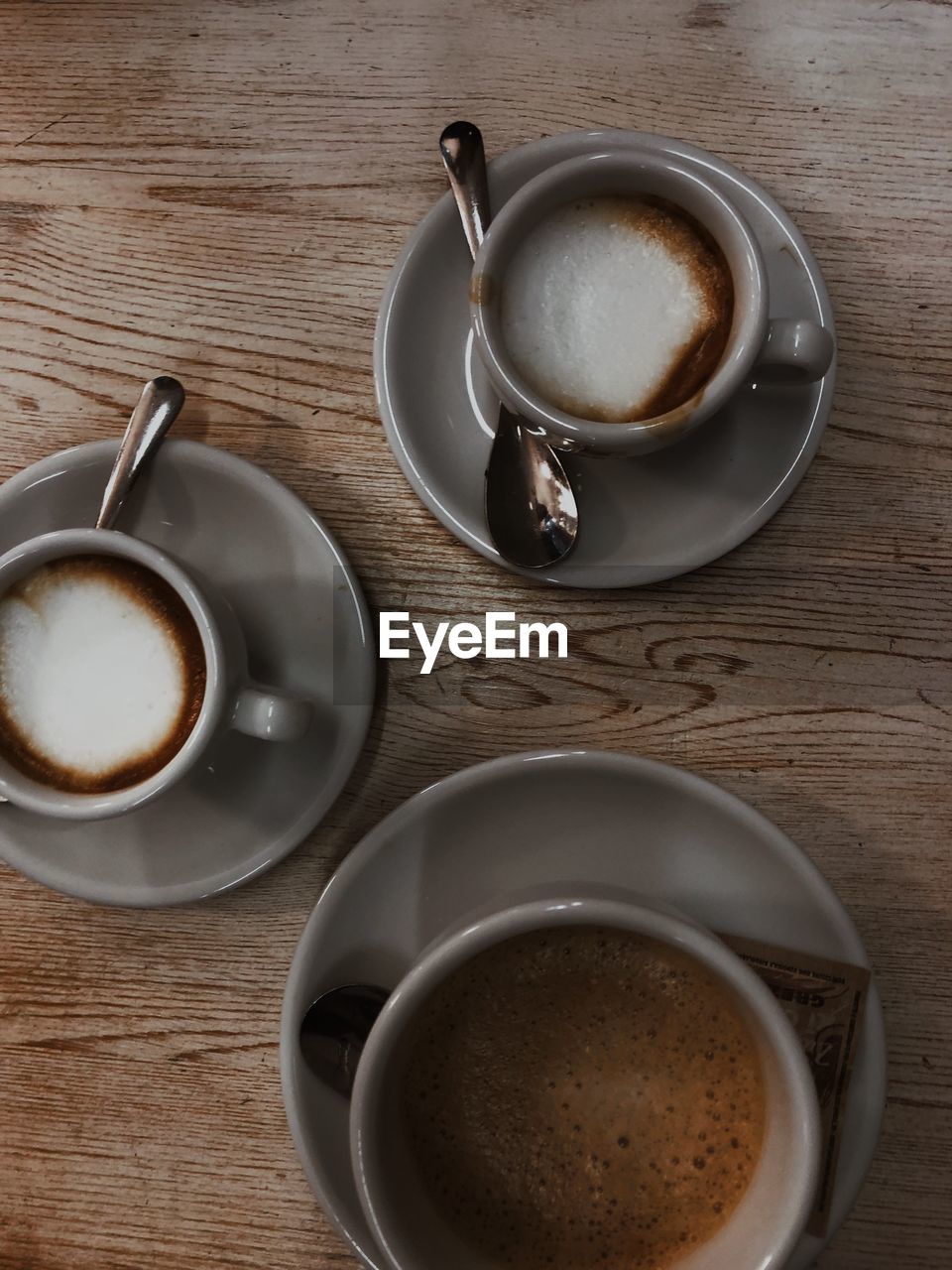 Directly above shot of coffee cups on table