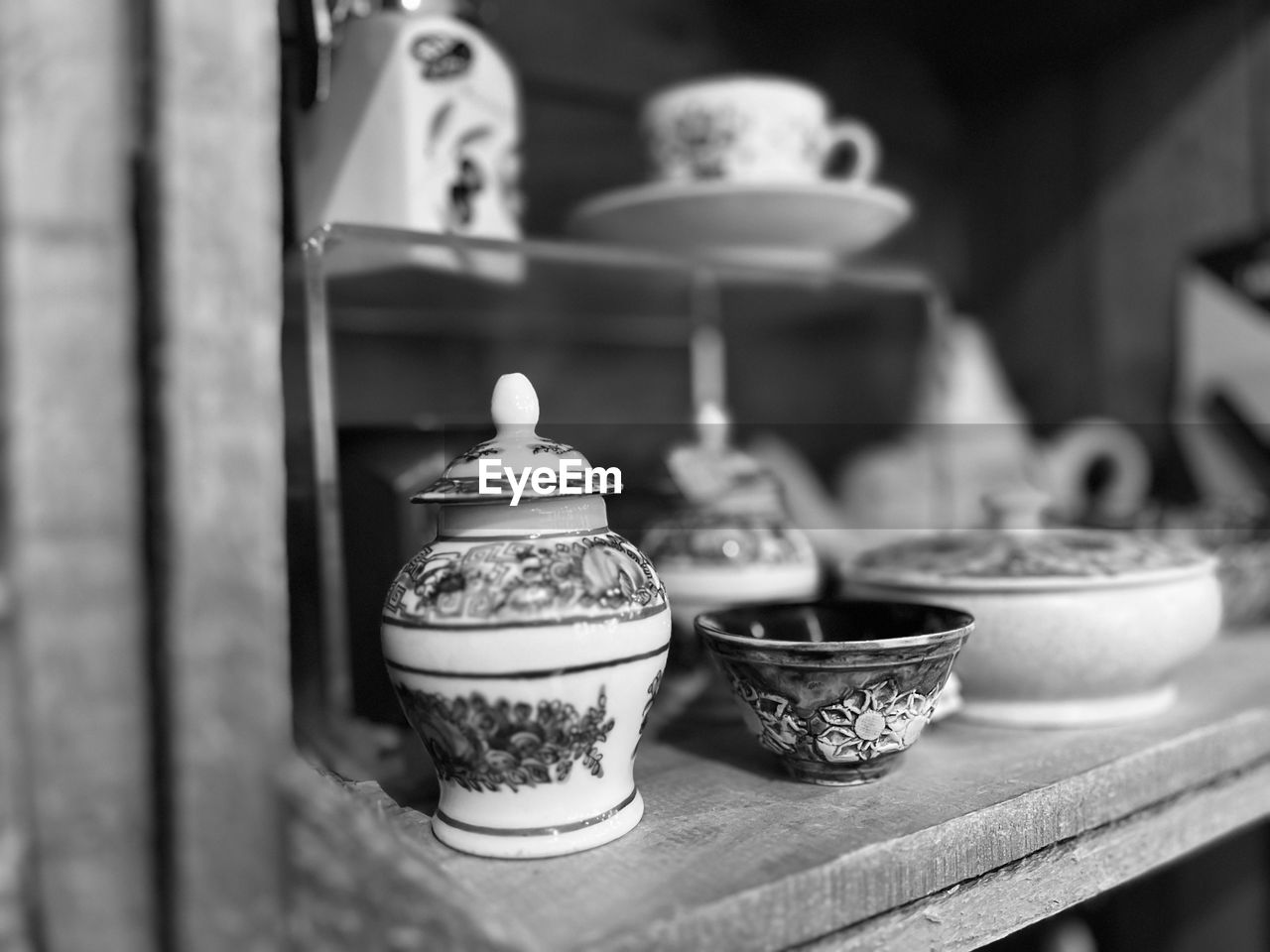 black and white, monochrome photography, monochrome, black, food and drink, no people, white, focus on foreground, ceramic, indoors, teapot, craft, food, pottery, selective focus, still life, table, cup, container, tea cup, porcelain, household equipment, crockery, mug, tradition