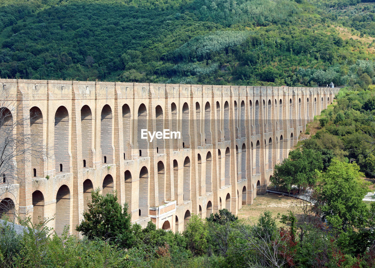 Very ancient acqueduct of caserta royal palace near naples in italy