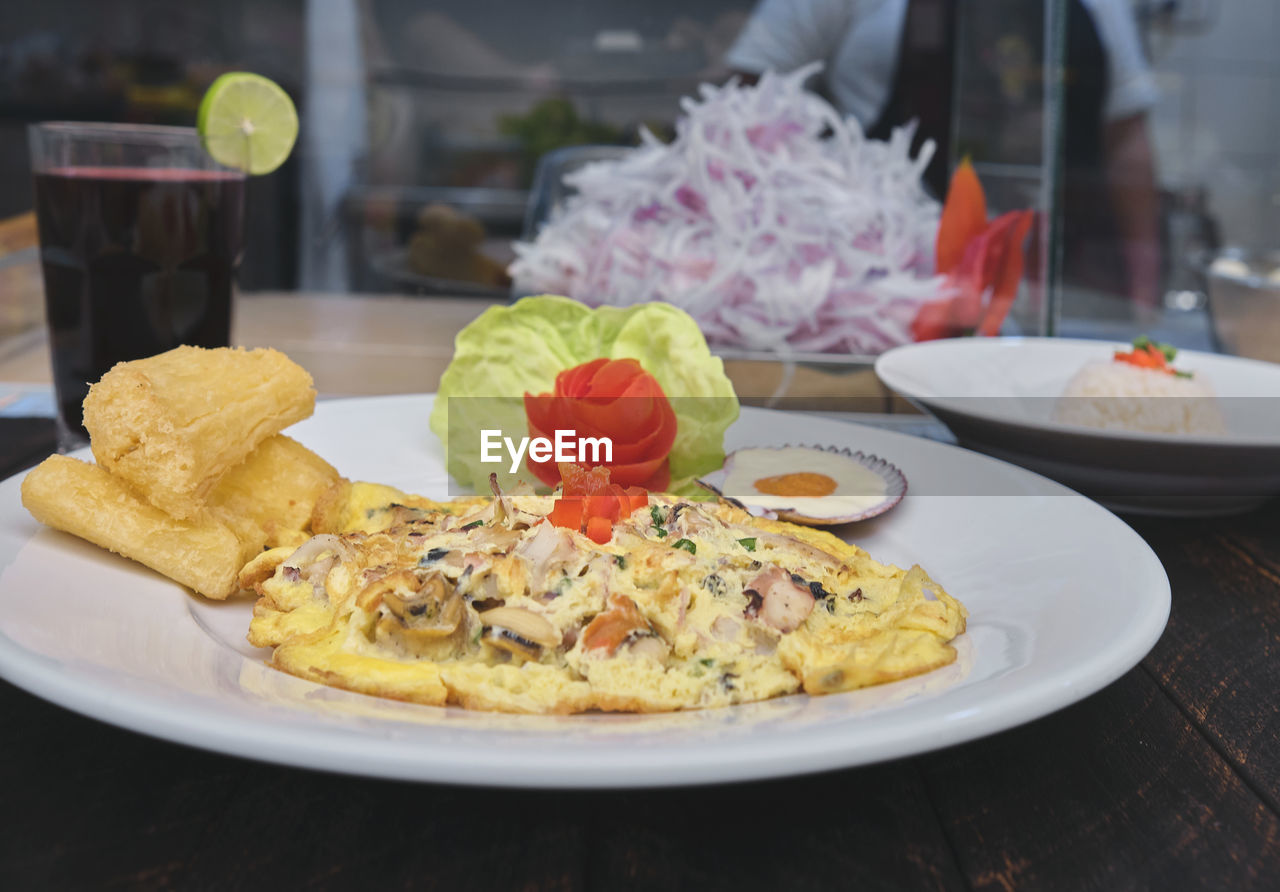 Peruvian food, tortilla de mariscos, seafood omelette, selective focus