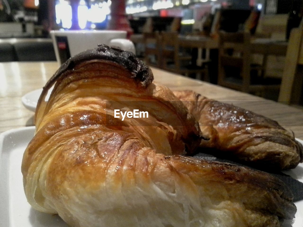 Close-up of serving croissant in plate