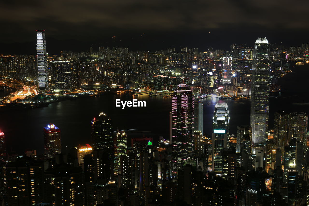 Aerial view of illuminated city buildings at night