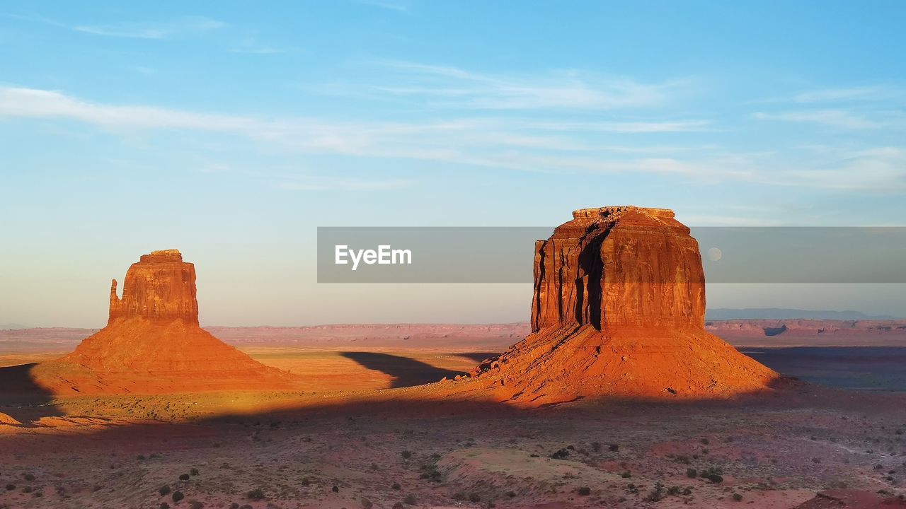 Rock formations on landscape against sky