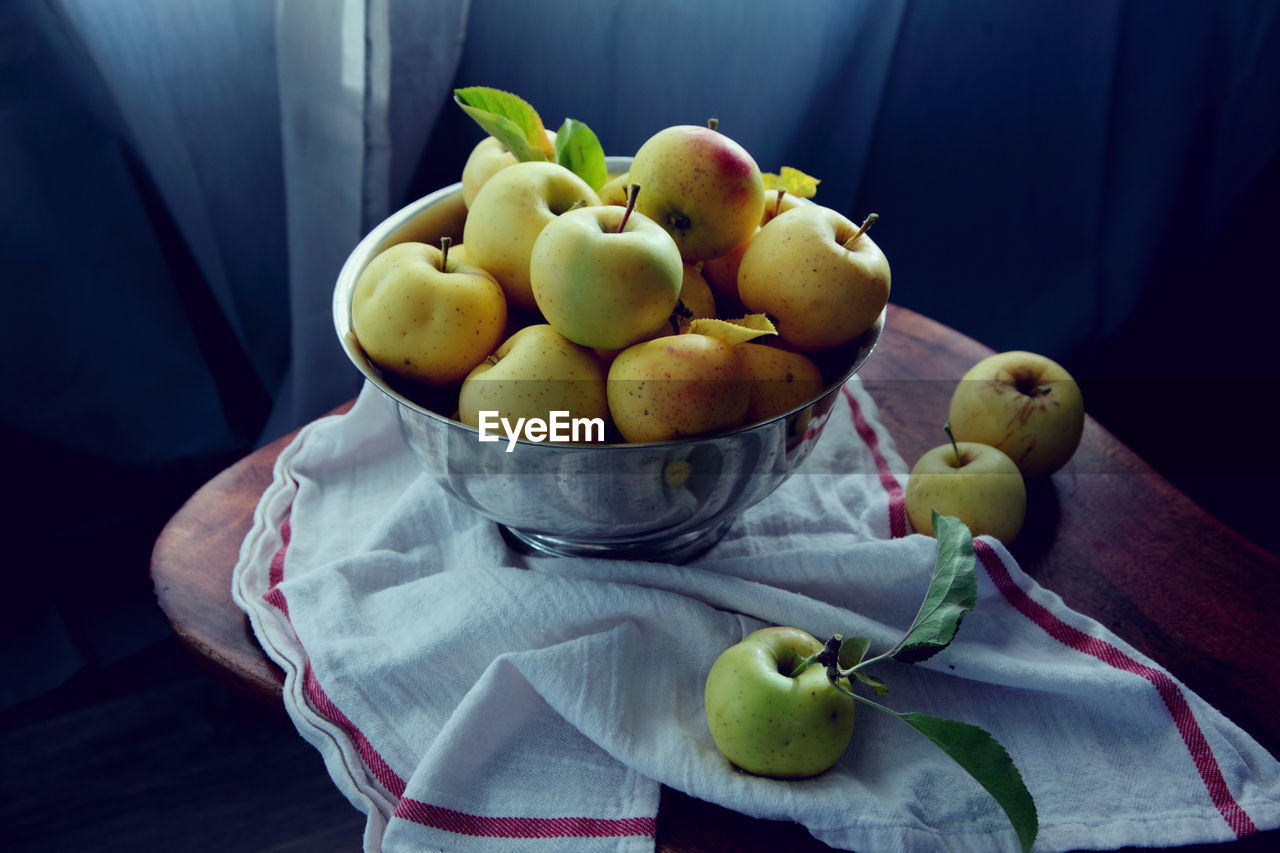 Close-up of fruits in bowl on table