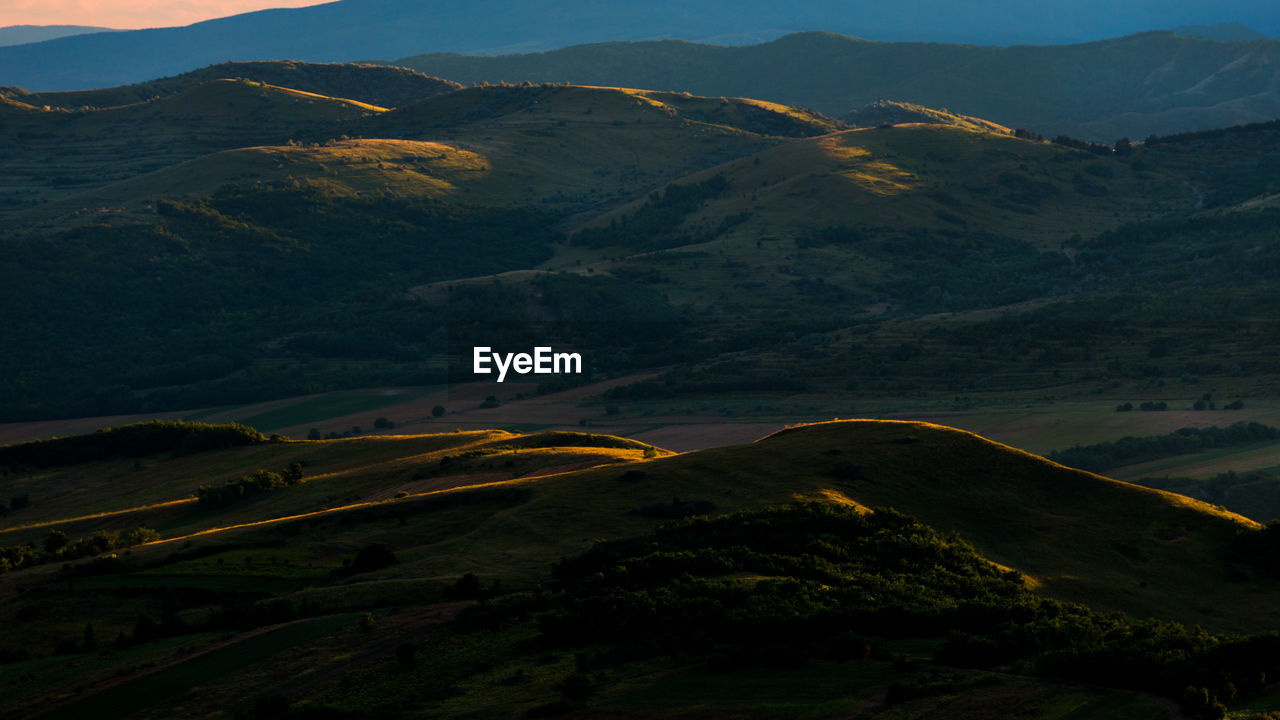 Tranquil rural scene with green hills