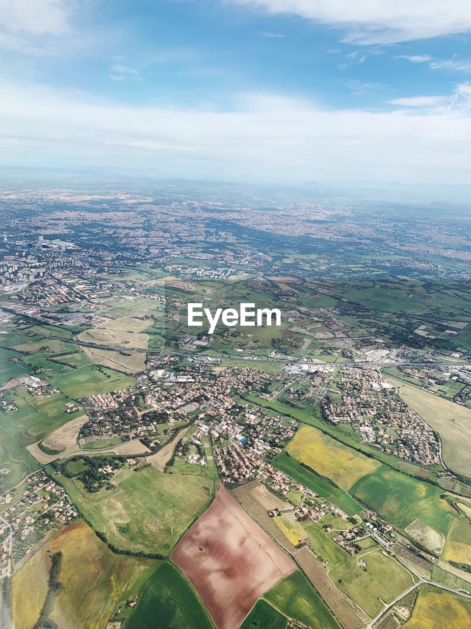 Aerial view of agricultural field against sky