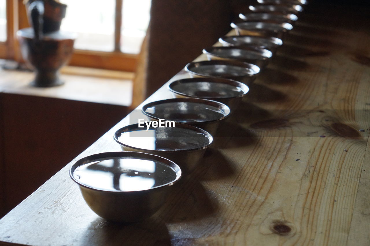 CLOSE-UP HIGH ANGLE VIEW OF CANDLES ON TABLE