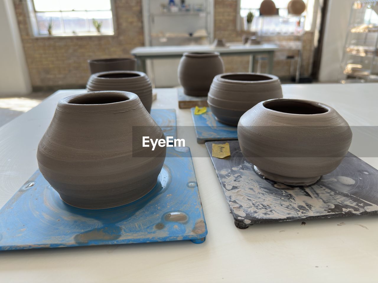 art, craft, pottery, potter's wheel, clay, ceramic, workshop, indoors, creativity, earthenware, wheel, no people, business, wood, working, occupation, small business, skill, business finance and industry, industry