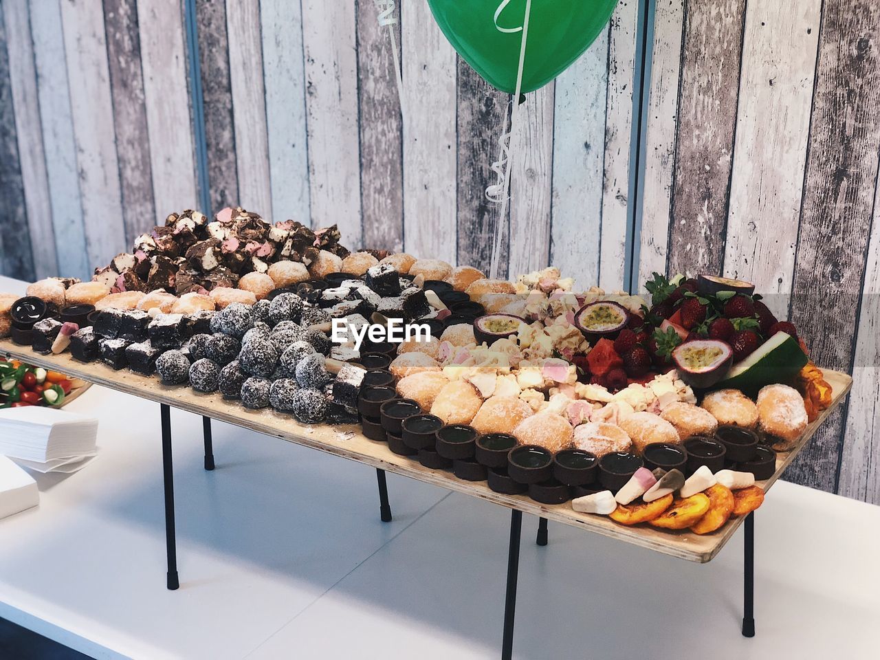 High angle view of various dessert on table