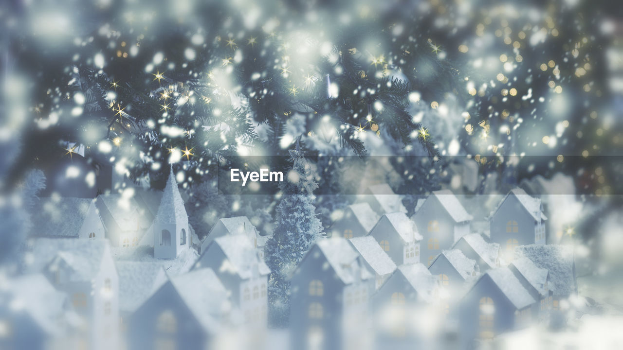 Close-up of model houses and christmas trees