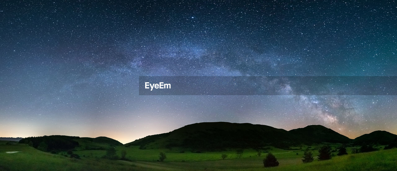 low angle view of mountain against sky at night