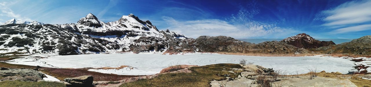 panoramic view of snowcapped mountains against sky