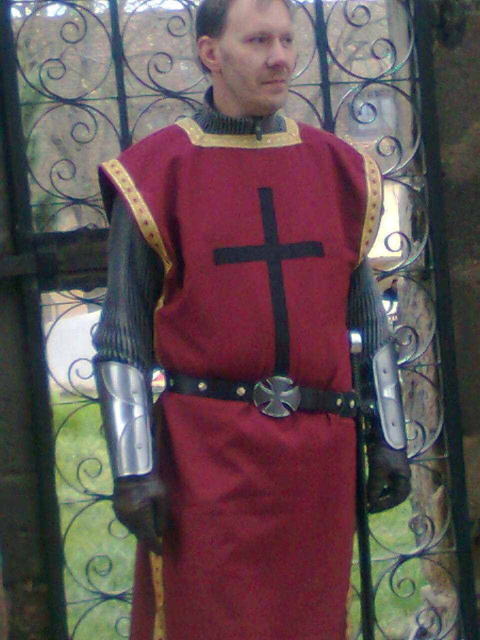 MID ADULT MAN STANDING IN FRONT OF HISTORIC