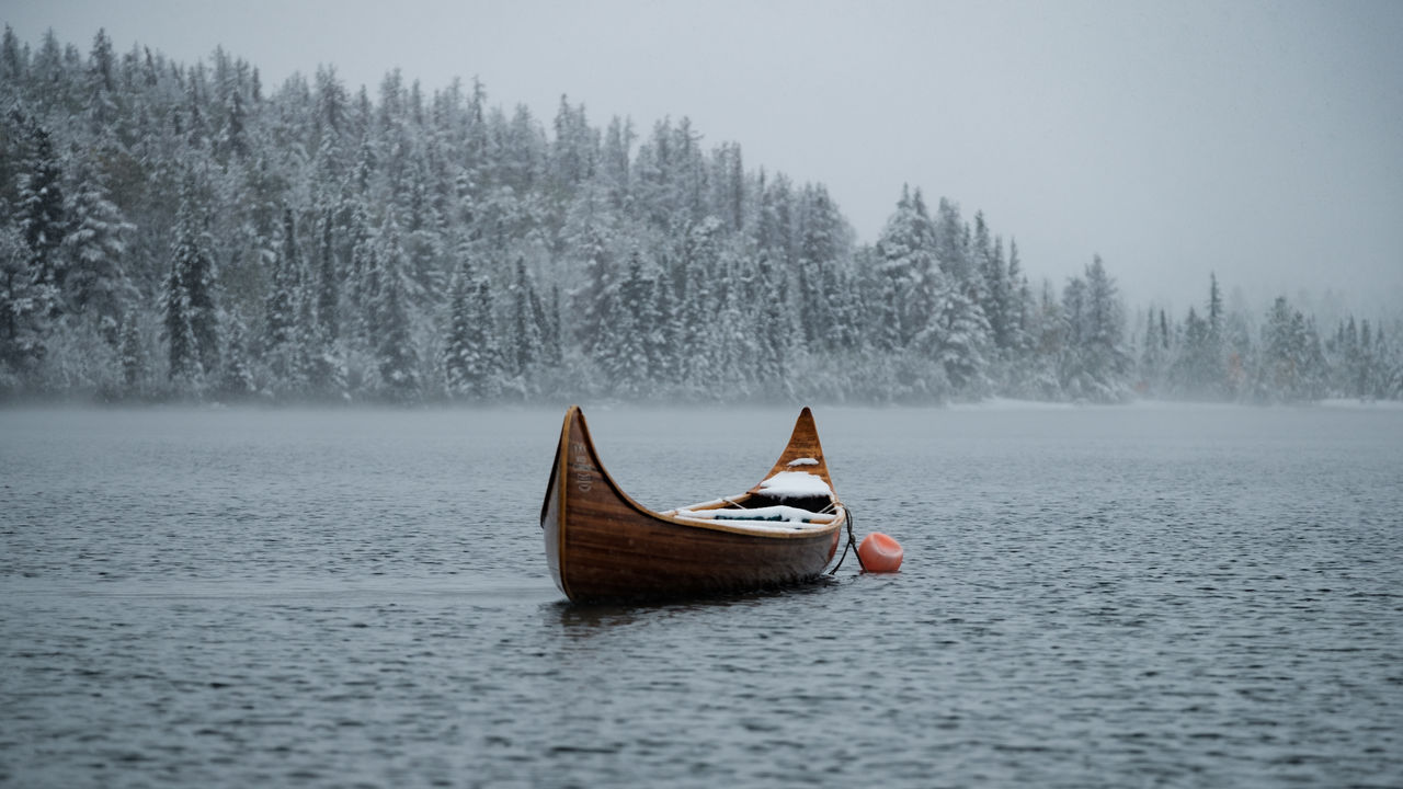 BOAT IN SNOW COVERED LAND