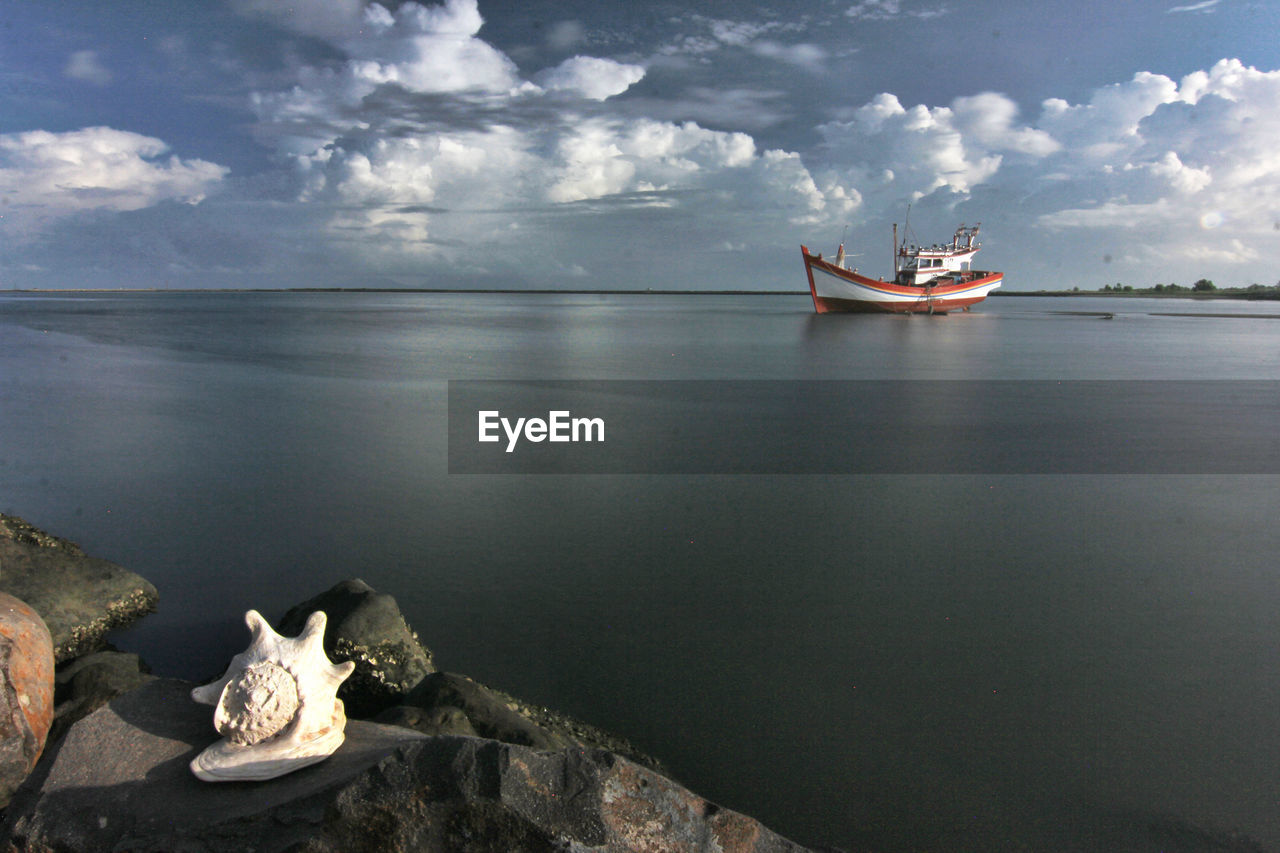 scenic view of sea against cloudy sky