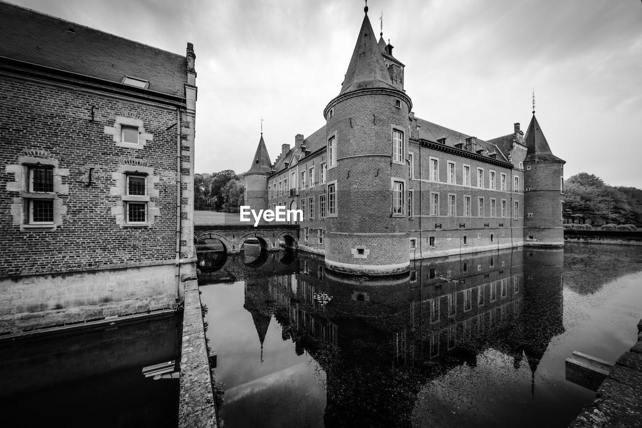 architecture, built structure, water, building exterior, black and white, sky, travel destinations, reflection, building, monochrome, nature, monochrome photography, city, history, cloud, the past, travel, river, tourism, cityscape, no people, castle, waterway, outdoors, old, transportation, bridge, tower, nautical vessel, water castle
