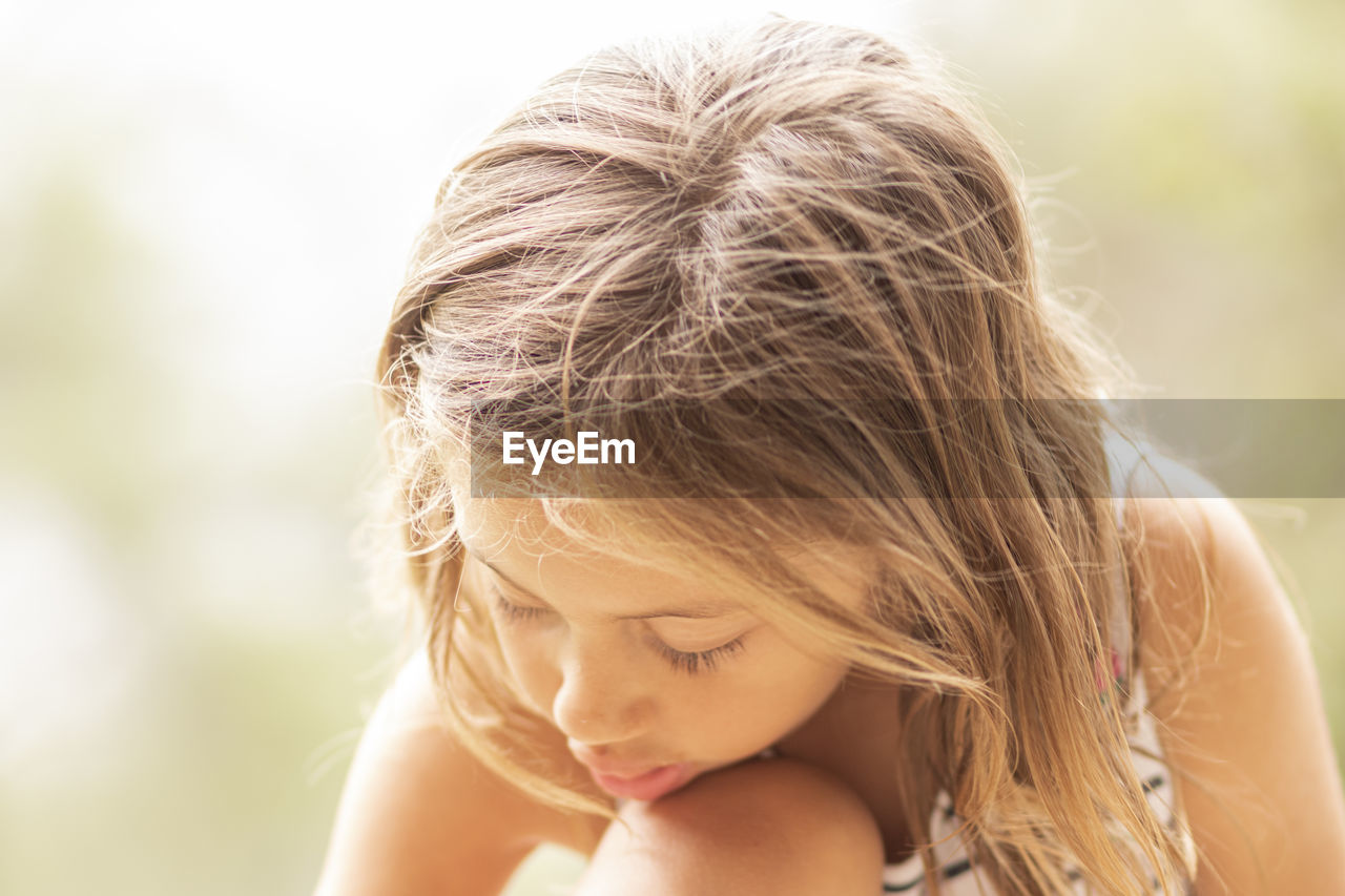 Close-up of girl looking down