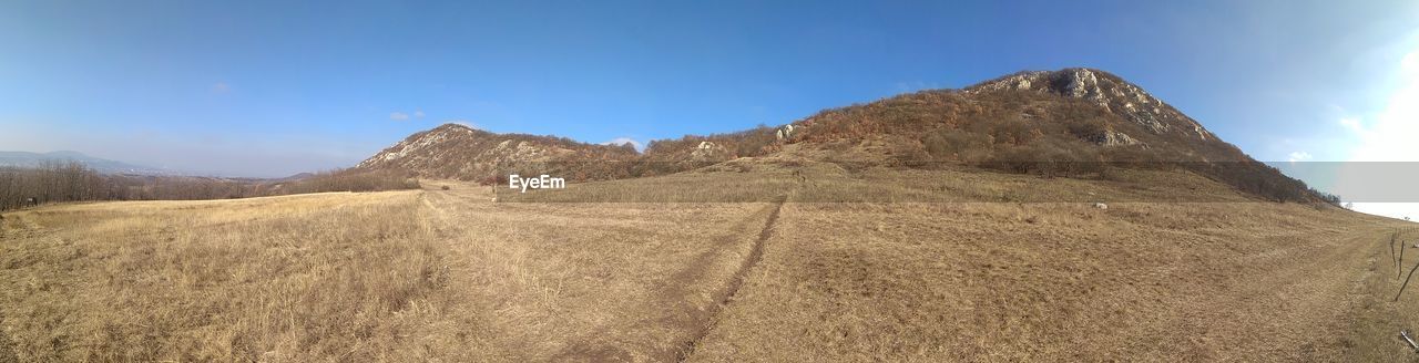 MOUNTAIN RANGE AGAINST CLEAR BLUE SKY