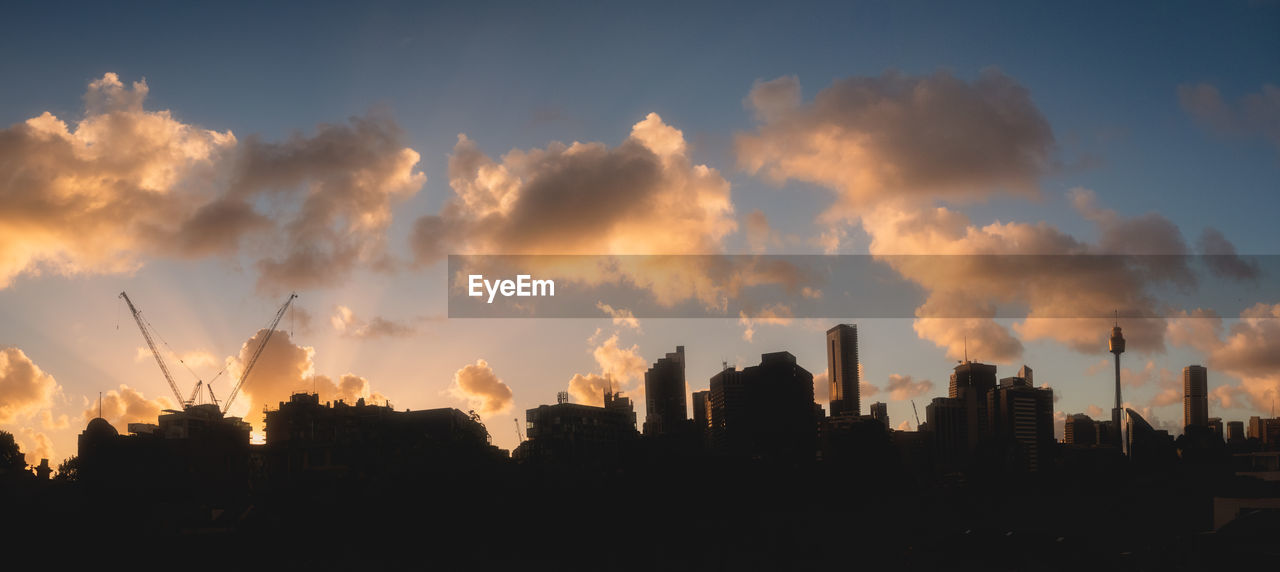 sky, cloud, architecture, city, landscape, skyline, building exterior, sunset, horizon, nature, built structure, dusk, urban skyline, silhouette, panoramic, building, evening, cityscape, afterglow, environment, no people, skyscraper, outdoors, office building exterior, sunlight, beauty in nature, travel destinations, scenics - nature, dramatic sky, city life
