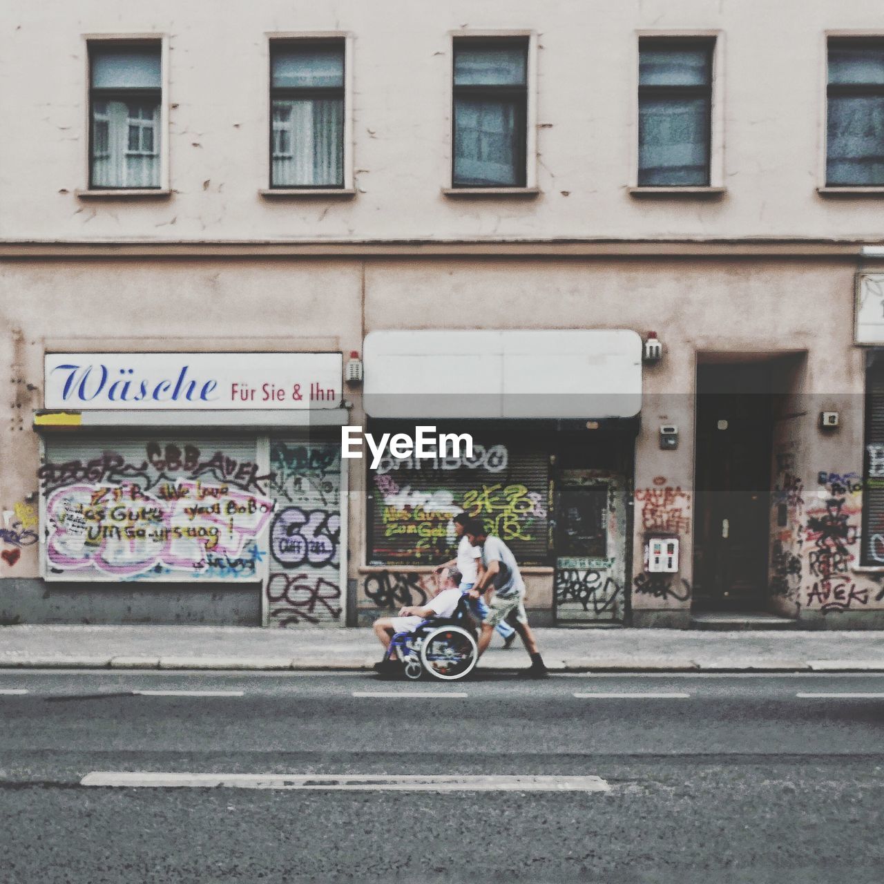 MAN CYCLING ON STREET