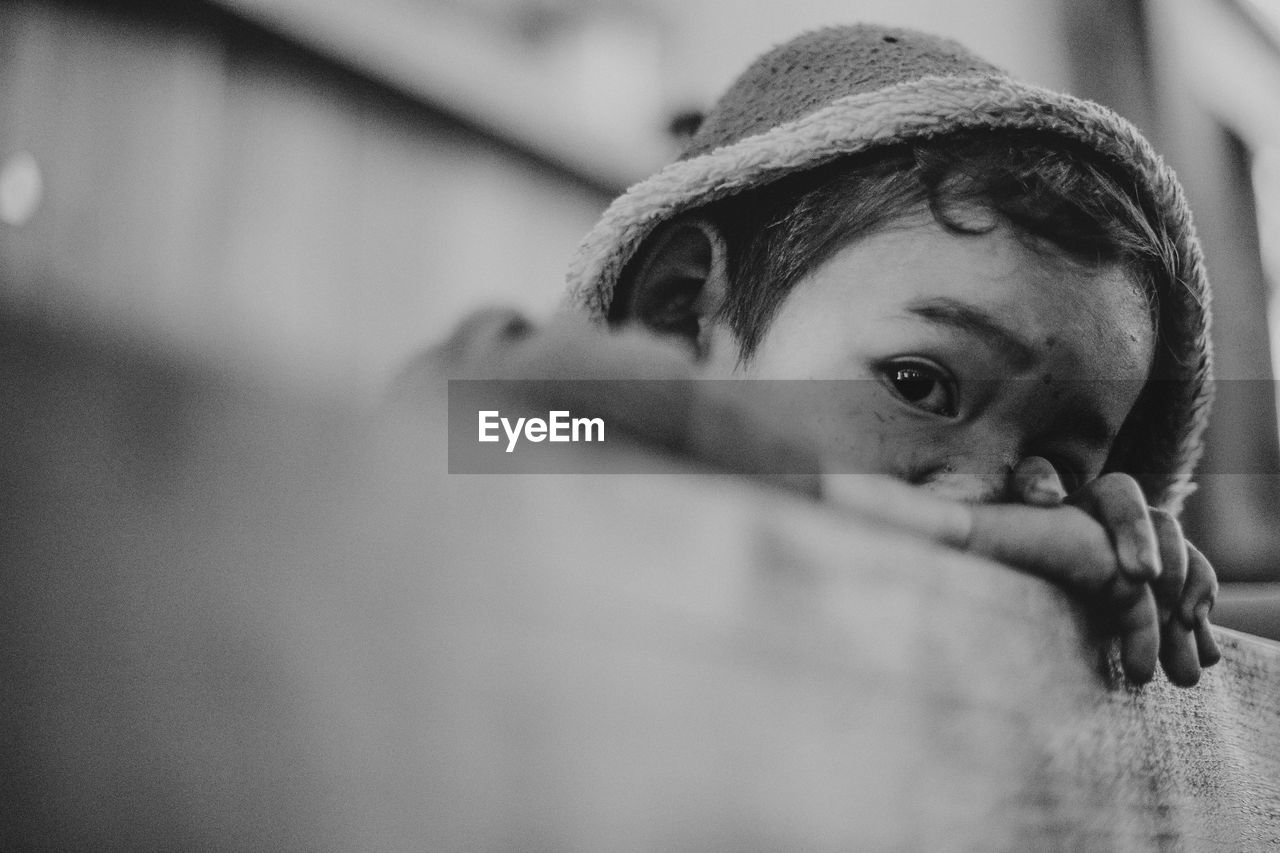 Close-up portrait of boy wearing hooded jacket