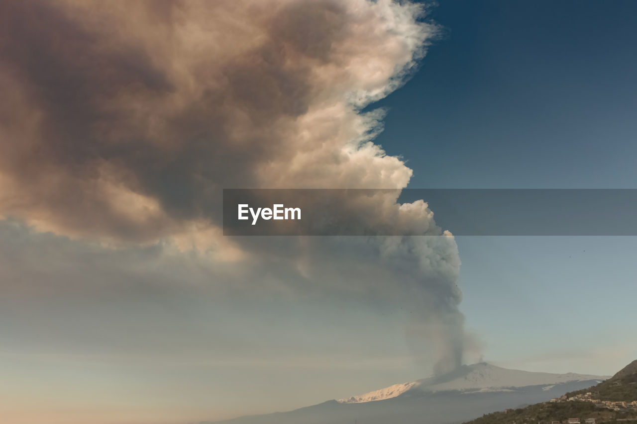 SCENIC VIEW OF CLOUDS OVER MOUNTAIN