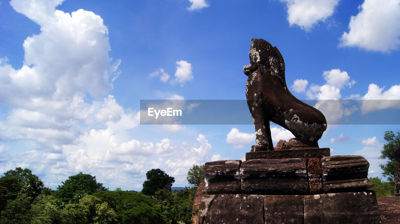 Low angle view of statue against sky