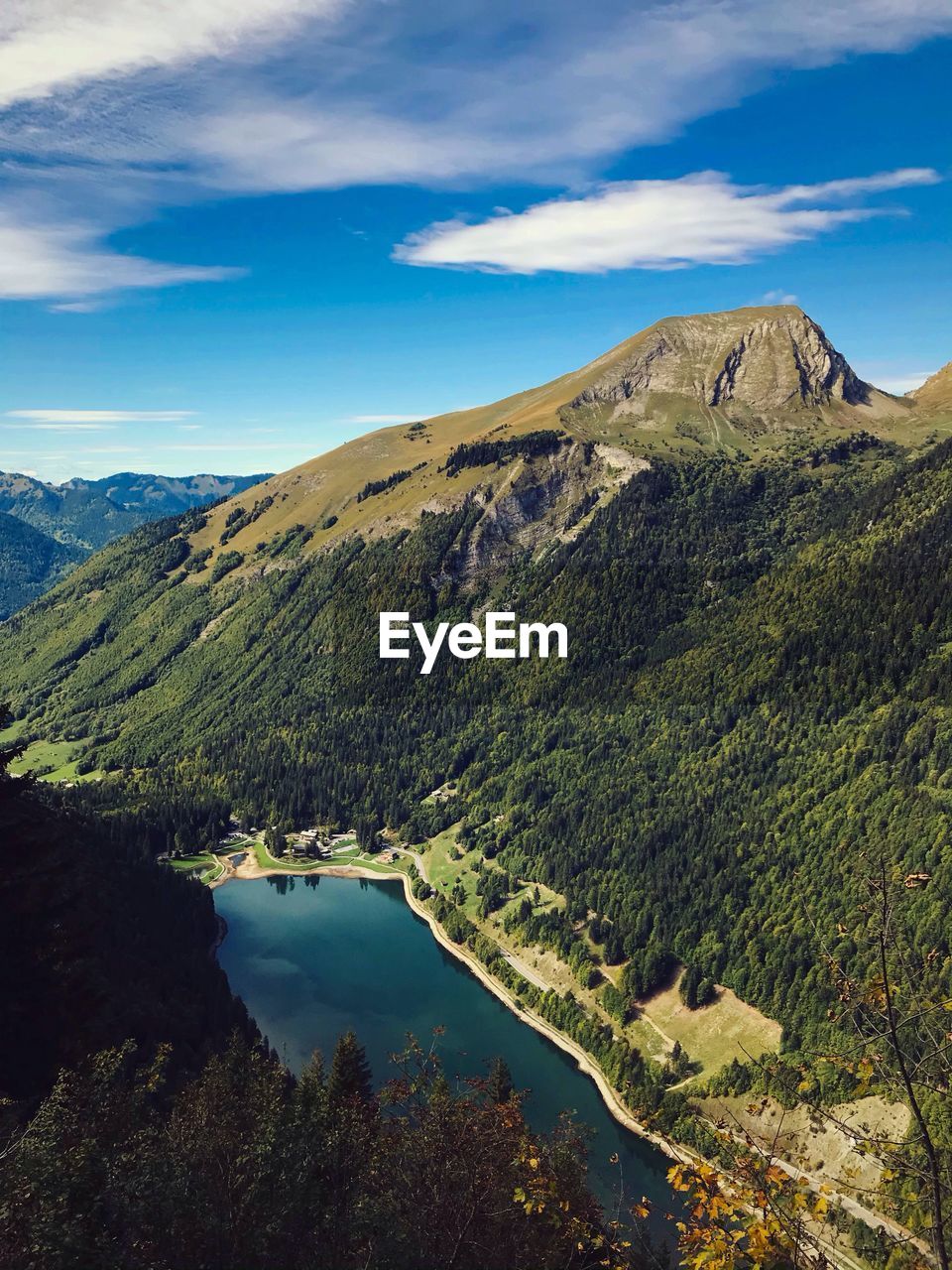 Scenic view of lake and mountains against sky