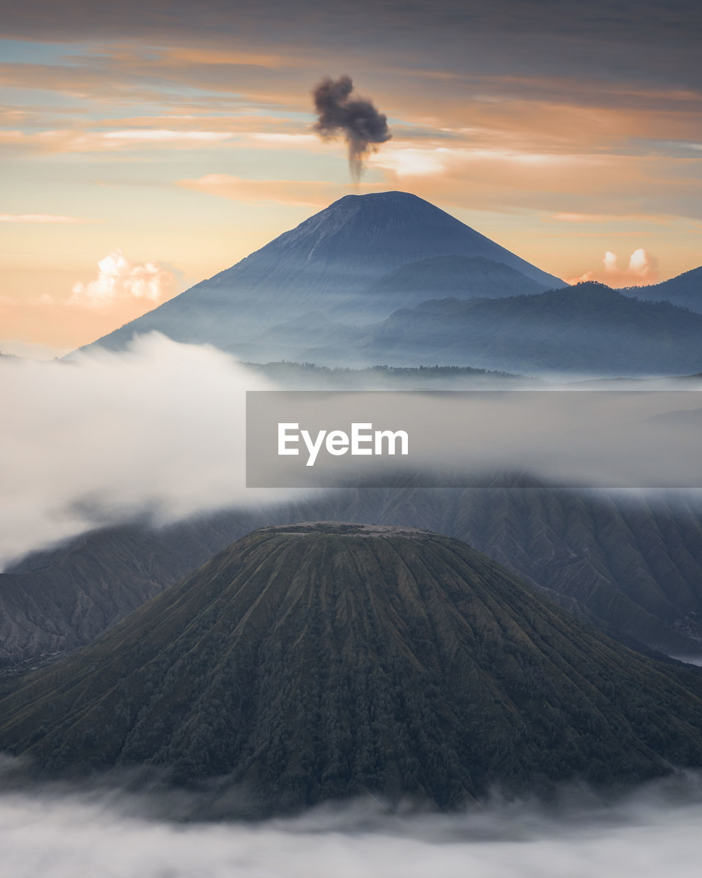 Scenic view of volcanic landscape against sky during sunset