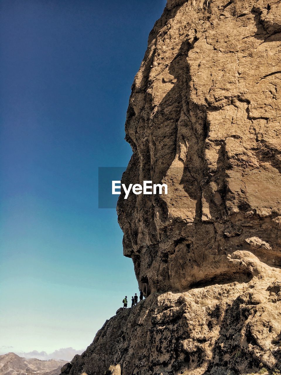 Low angle view of rock formation against clear sky