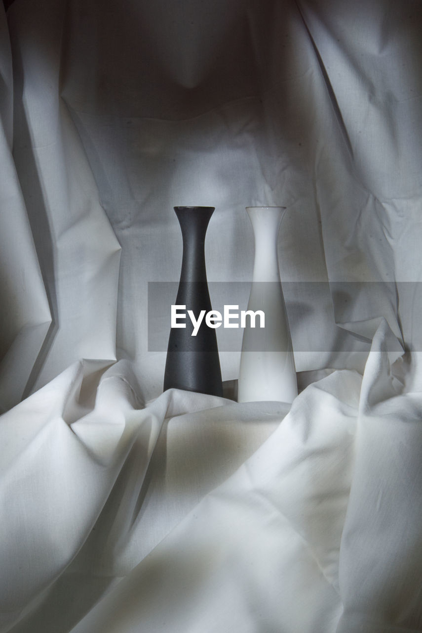 white, black and white, indoors, no people, textile, monochrome, bed, furniture, wedding dress, linen, close-up, monochrome photography, black, crumpled, light