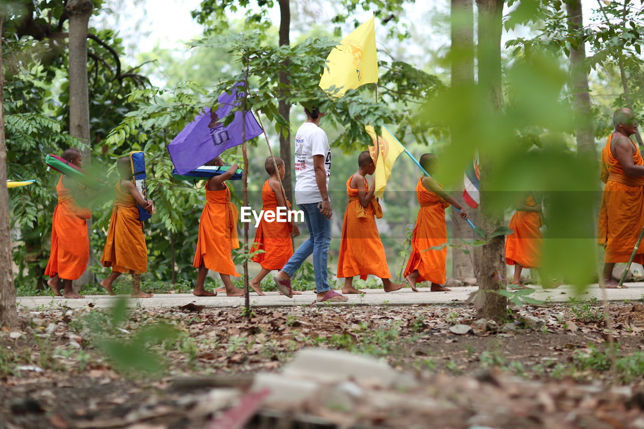 GROUP OF PEOPLE AT TEMPLE