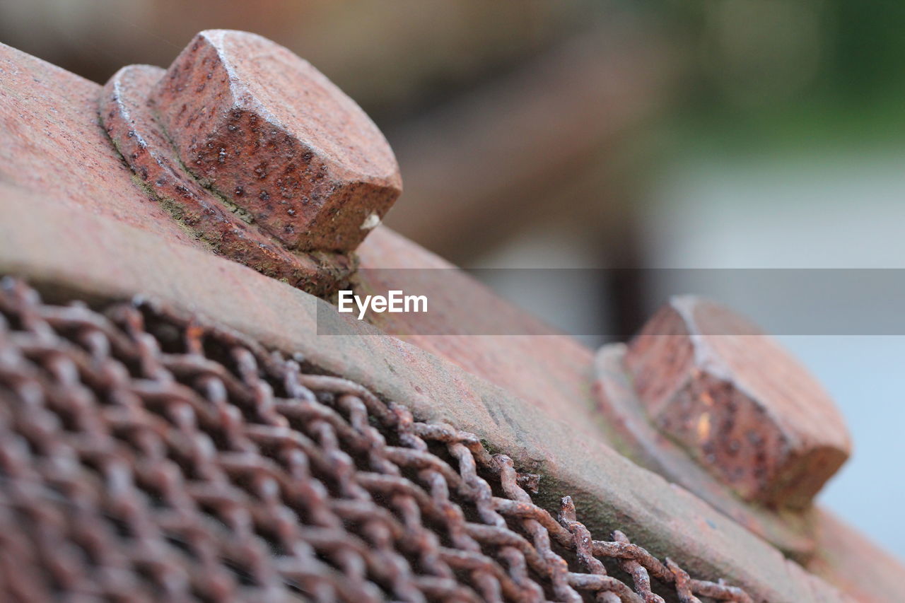 Close-up of rusty bolts on metal