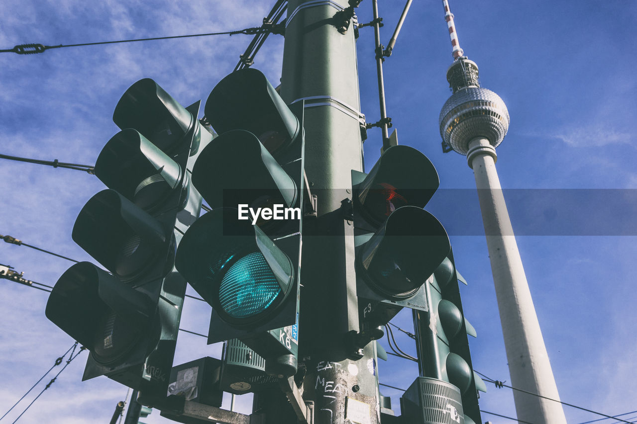 Low angle view of stoplights against fernsehturm