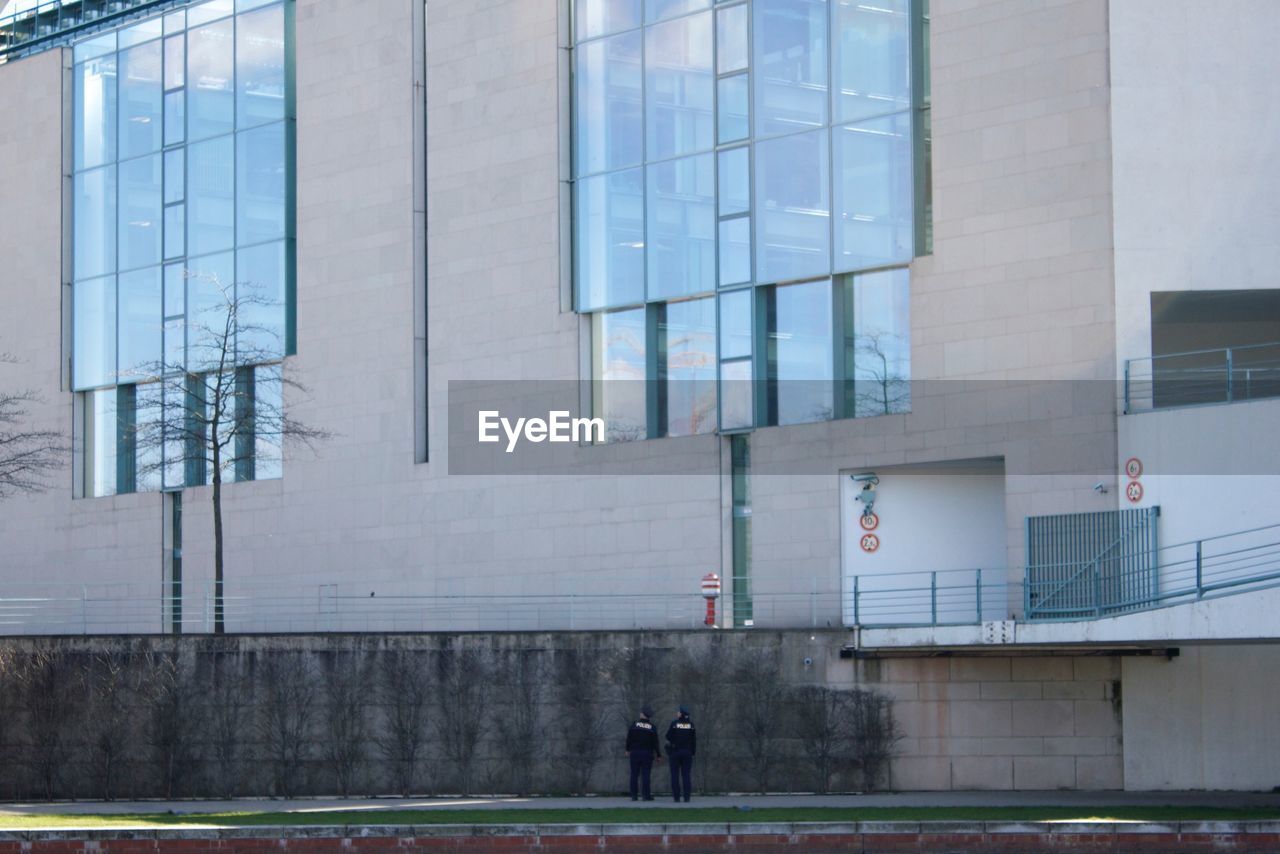 Security guards standing in front of building