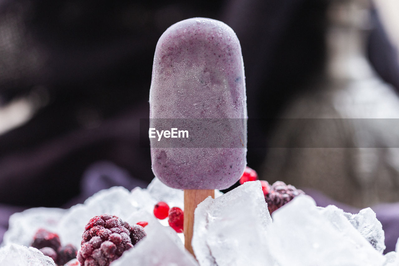 CLOSE-UP OF ICE CREAM ON FRUIT