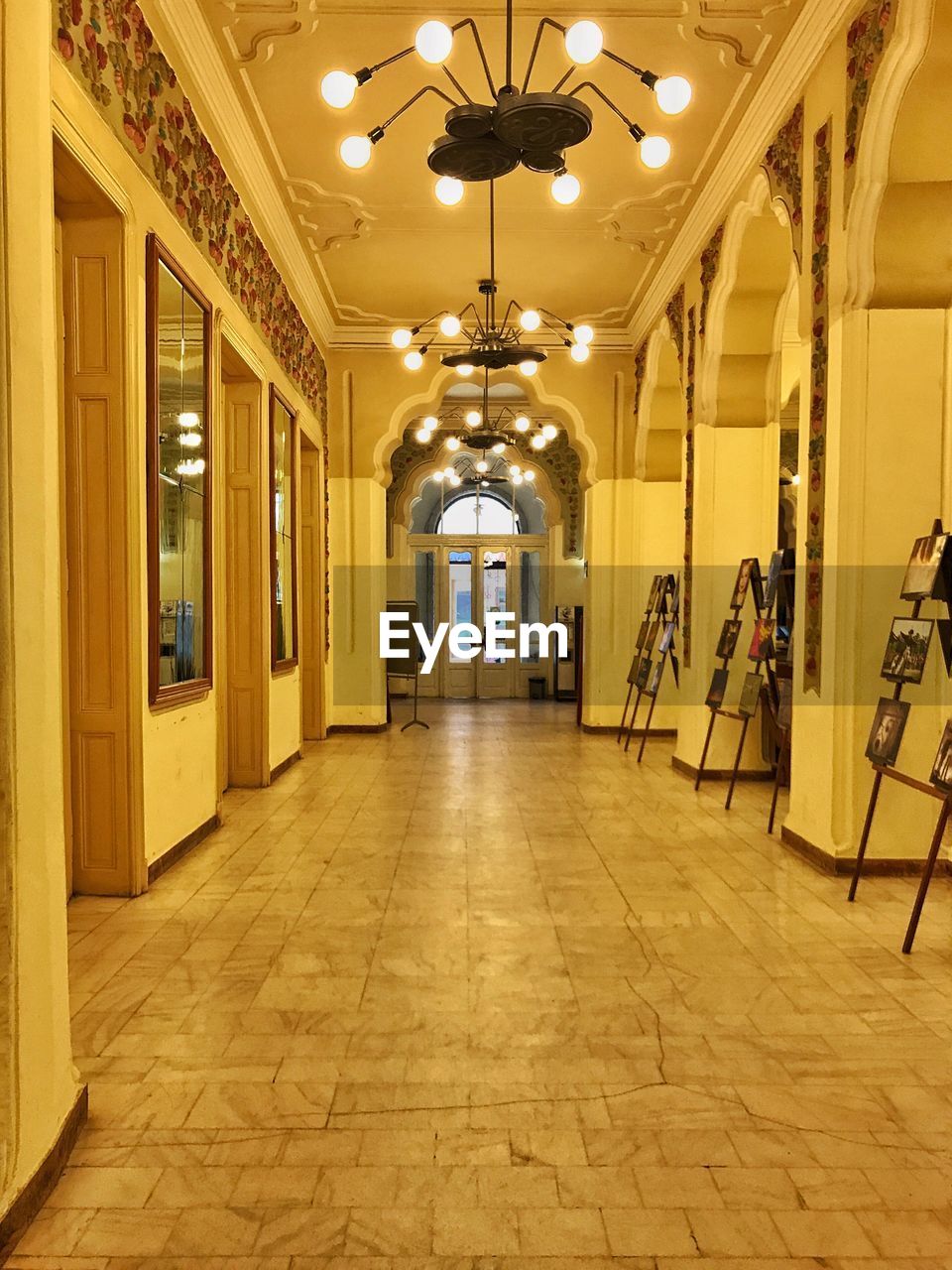 ILLUMINATED CORRIDOR OF YELLOW BUILDING