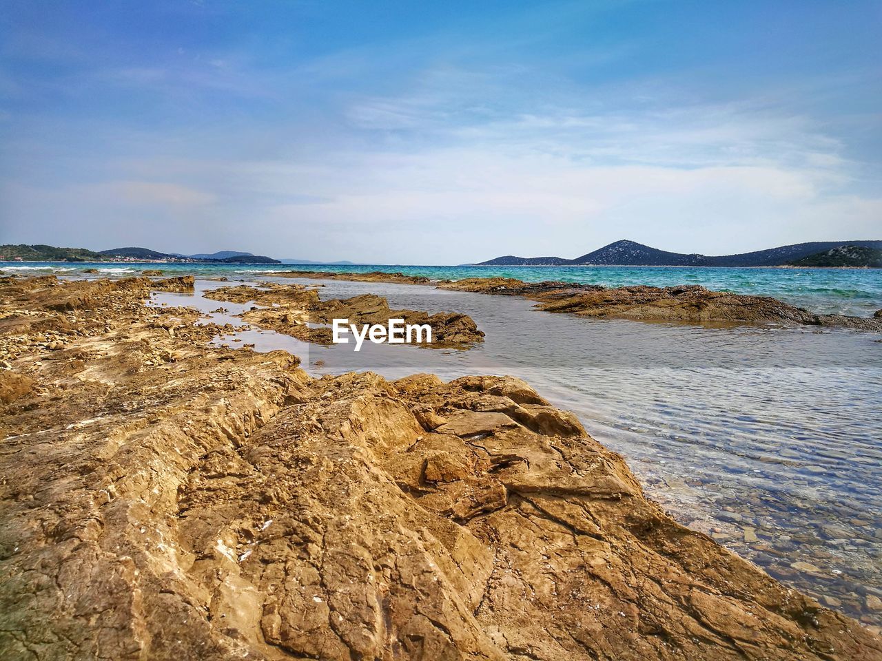 Scenic view of beach against sky