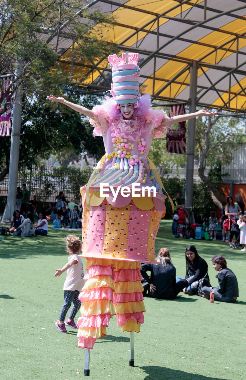 VIEW OF STATUE OF MAN WITH PINK STATUES