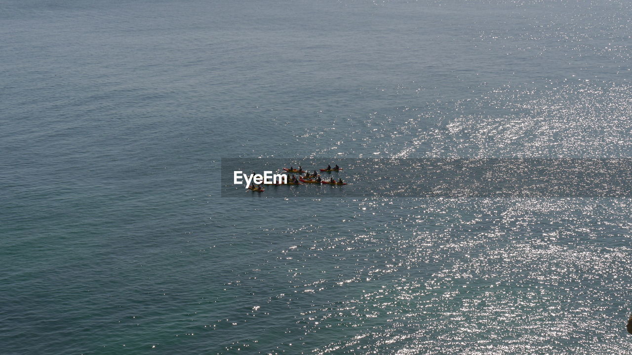 High angle view of people in conoes on sea