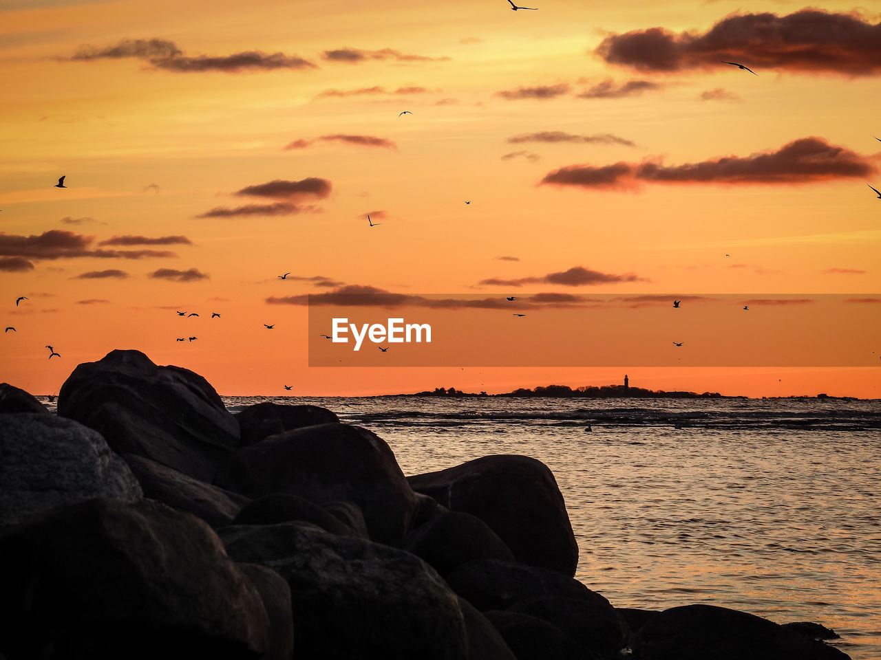 Scenic view of sea against sky during sunset