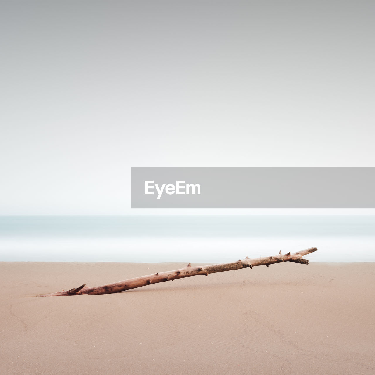 Scenic view of beach against clear sky