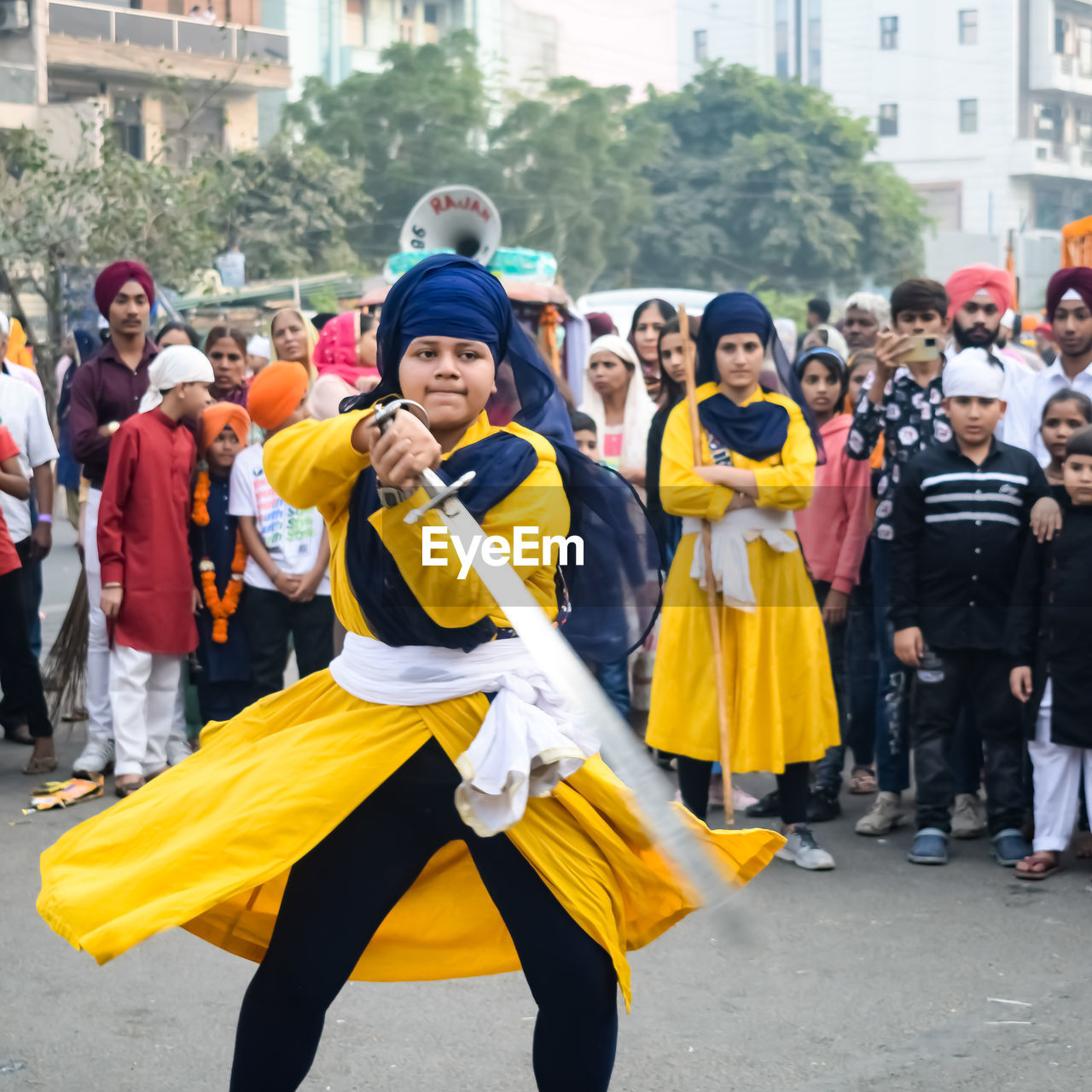 crowd, group of people, city, large group of people, architecture, event, yellow, women, men, adult, street, full length, festival, clothing, celebration, arts culture and entertainment, happiness, building exterior, costume, togetherness, carnival, emotion, female, enjoyment, smiling, outdoors, fun, child