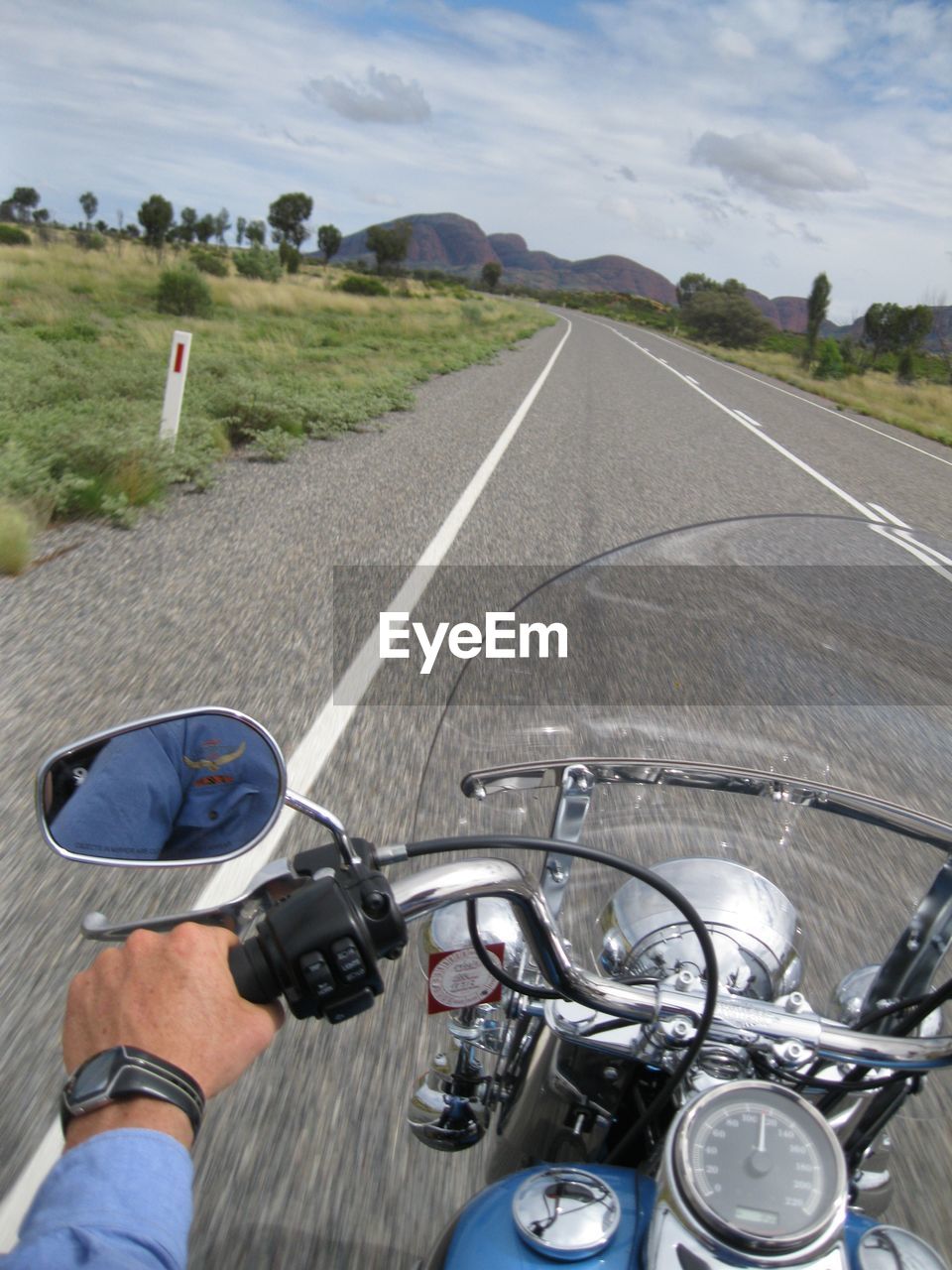 Man riding motorcycle on road